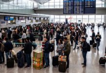 Filipino job seekers warned of recruitment schemes linked to foreign military service Prospective travelers queue at a generic international airport terminal. This image is a photo-illustration created with AI for illustrative purposes and does not depict specific individuals or locations related to the current advisories.